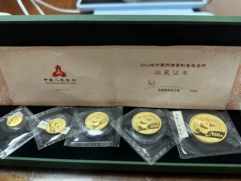2014熊猫金币一套回收价目表   哪里回收2014年熊猫金币